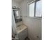 Functional bathroom with a single sink vanity, basic fixtures, and a neutral color scheme, offering essential amenities at 4065 E University Dr # 88, Mesa, AZ 85205