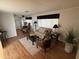 Cozy living room with wood-style flooring, comfortable seating, and natural light, creating an inviting atmosphere at 4065 E University Dr # 88, Mesa, AZ 85205