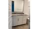 Bathroom with a modern vanity featuring a granite countertop and white cabinetry at 4077 S Sabrina Dr # 94, Chandler, AZ 85248