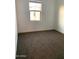 Bedroom featuring carpet floors, white walls, and natural lighting at 4077 S Sabrina Dr # 94, Chandler, AZ 85248