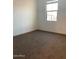 Bright bedroom with natural light from a large window and neutral carpet at 4077 S Sabrina Dr # 94, Chandler, AZ 85248