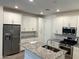 Modern kitchen with stainless appliances, granite countertops and white cabinets at 4077 S Sabrina Dr # 94, Chandler, AZ 85248