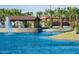 Scenic pond with a fountain and a covered picnic area, surrounded by palm trees at 4077 S Sabrina Dr # 94, Chandler, AZ 85248