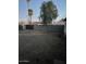 A large backyard features a block fence and mature landscaping at 4301 N 72Nd Ln, Phoenix, AZ 85033