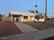 Cozy one story house features a covered carport and a tidy front lawn at 4301 N 72Nd Ln, Phoenix, AZ 85033