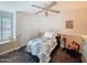 Comfortable bedroom with a ceiling fan, closet, and a cozy single bed at 5601 E Monte Cristo Ave, Scottsdale, AZ 85254