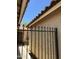 Exterior view of courtyard with iron gate and tan stucco walls, offering privacy at 5601 E Monte Cristo Ave, Scottsdale, AZ 85254