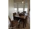 Cozy dining area with woven chairs and natural light from large windows at 5601 E Monte Cristo Ave, Scottsdale, AZ 85254