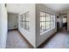 Bright hallway featuring neutral tile and large windows at 5601 E Monte Cristo Ave, Scottsdale, AZ 85254