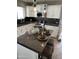 Kitchen island with breakfast bar, decorative bowls, and stainless steel appliances at 5601 E Monte Cristo Ave, Scottsdale, AZ 85254