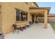 Covered back patio with ceiling fan, perfect for outdoor living at 608 E Pasaro Dr, Phoenix, AZ 85085