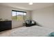 Bedroom with carpeted floors, a sofa, dresser, and a view of desert hills at 608 E Pasaro Dr, Phoenix, AZ 85085