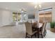 Open dining area with tiled flooring, a chandelier and natural light, perfect for Gathering gatherings at 608 E Pasaro Dr, Phoenix, AZ 85085