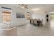 Bright dining area with neutral walls, tiled floors, and a view to the outdoor living space at 608 E Pasaro Dr, Phoenix, AZ 85085