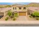 Beautiful two-story home featuring a tile roof, desert landscaping, and a two-car garage at 608 E Pasaro Dr, Phoenix, AZ 85085