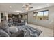 Bright living room with a large window and open access to the kitchen, perfect for modern living at 608 E Pasaro Dr, Phoenix, AZ 85085