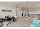 Open loft space with a 'Music Room' sign, carpet, and ample lighting, ideal for creative activities at 608 E Pasaro Dr, Phoenix, AZ 85085