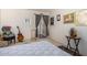Cozy bedroom with a patterned bedspread, neutral walls, and a decorative table at 6118 N 12Th Pl # 2, Phoenix, AZ 85014