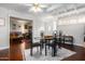 Hardwood floors, ceiling fan, open to living room, glass table and 4 chairs, and bright light at 6118 N 12Th Pl # 2, Phoenix, AZ 85014
