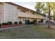 Exterior view of a two-story apartment building with well-maintained landscaping at 6118 N 12Th Pl # 2, Phoenix, AZ 85014