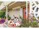Cozy front porch featuring potted plants, decorative ironwork, and a secure gated entry at 6118 N 12Th Pl # 2, Phoenix, AZ 85014