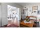 Spacious living room with hardwood floors offering an open layout with a view of the kitchen at 6118 N 12Th Pl # 2, Phoenix, AZ 85014