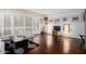 Bright living room with hardwood floors, large windows with shutters, and stylish decor at 6118 N 12Th Pl # 2, Phoenix, AZ 85014