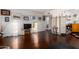 Open-concept living room featuring hardwood floors, modern lighting, and a decorative room divider at 6118 N 12Th Pl # 2, Phoenix, AZ 85014