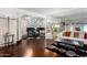 Living room featuring hardwood floors, mirrored wall, and a piano at 6118 N 12Th Pl # 2, Phoenix, AZ 85014