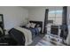 Simple bedroom with a bed, workspace, and neutral tones, perfect for a minimalist lifestyle at 6278 N 31St Way, Phoenix, AZ 85016