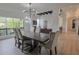 Bright dining room with modern light fixture and views into the living room and hallway at 6278 N 31St Way, Phoenix, AZ 85016
