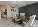 Dining room with wood table, upholstered chairs, and dark accent wall at 6278 N 31St Way, Phoenix, AZ 85016