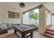 Spacious game room with a pool table and cozy outdoor seating area at 6278 N 31St Way, Phoenix, AZ 85016
