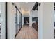 Spacious hallway with natural light, wood flooring, and views into other living spaces at 6278 N 31St Way, Phoenix, AZ 85016