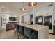 Open concept kitchen with an expansive island, bar seating, and modern appliances at 6278 N 31St Way, Phoenix, AZ 85016