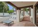Serene covered patio featuring a lounge area and calming pool view at 6278 N 31St Way, Phoenix, AZ 85016
