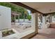 Inviting patio boasts built-in seating, lush greenery, and a tranquil pool view at 6278 N 31St Way, Phoenix, AZ 85016