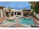 Beautiful pool area with palm trees, outdoor seating, and seamless indoor-outdoor living at 6278 N 31St Way, Phoenix, AZ 85016