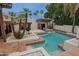 Gorgeous backyard with a pool, spa, and mature palm trees, perfect for outdoor living and entertaining at 6278 N 31St Way, Phoenix, AZ 85016