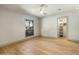 Bright bedroom with hardwood floors, a ceiling fan, and an organized closet at 8361 E Via De Viva --, Scottsdale, AZ 85258
