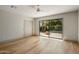 Bright bedroom with hardwood floors, ceiling fan, and sliding glass doors to the patio at 8361 E Via De Viva --, Scottsdale, AZ 85258
