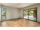 Spacious bedroom features hardwood floors, a ceiling fan, and sliding doors to the patio at 8361 E Via De Viva --, Scottsdale, AZ 85258