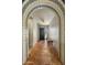 Hallway featuring decorative tile archway, neutral walls, and terra cotta tile flooring at 8361 E Via De Viva --, Scottsdale, AZ 85258