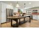 Bright kitchen features stainless steel appliances, white cabinets, large island, and decorative tile backsplash at 8361 E Via De Viva --, Scottsdale, AZ 85258