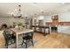 Open-concept kitchen and dining area, showcasing stainless steel appliances, island, and adjacent living space with fireplace at 8361 E Via De Viva --, Scottsdale, AZ 85258