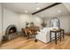 Living room featuring a brick fireplace, wooden beam, and comfortable seating arrangement at 8361 E Via De Viva --, Scottsdale, AZ 85258