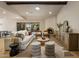 Bright living room with white sofa, fireplace, wood accents, and access to patio at 8361 E Via De Viva --, Scottsdale, AZ 85258