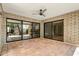 Spacious outdoor patio with terracotta tile flooring, ceiling fan, and sliding glass doors leading inside at 8361 E Via De Viva --, Scottsdale, AZ 85258