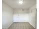 Spacious bedroom with neutral tile floors, closet, and a door for easy access at 930 S Acapulco Ln # D, Tempe, AZ 85281