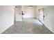 Open living room with tile flooring leading to dining area and kitchen at 930 S Acapulco Ln # D, Tempe, AZ 85281